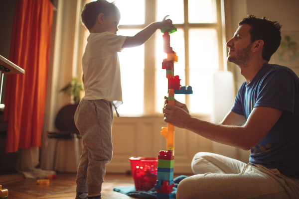 Father and son building a castle